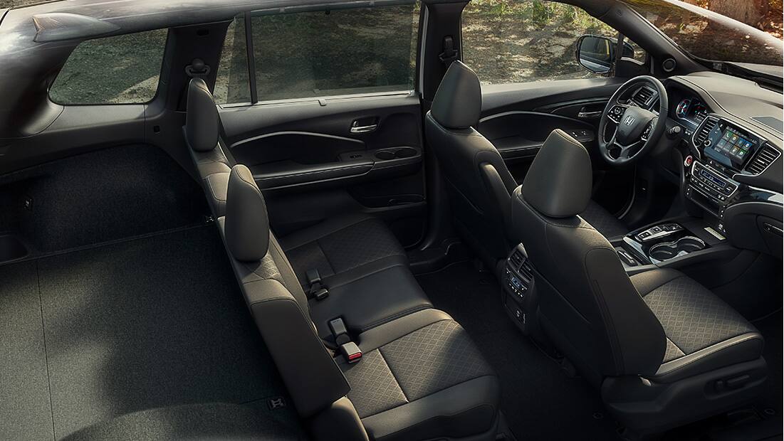 Full interior shot of the 2019 Honda Passport Elite in Black Leather displaying spacious interior and cargo capacity. 