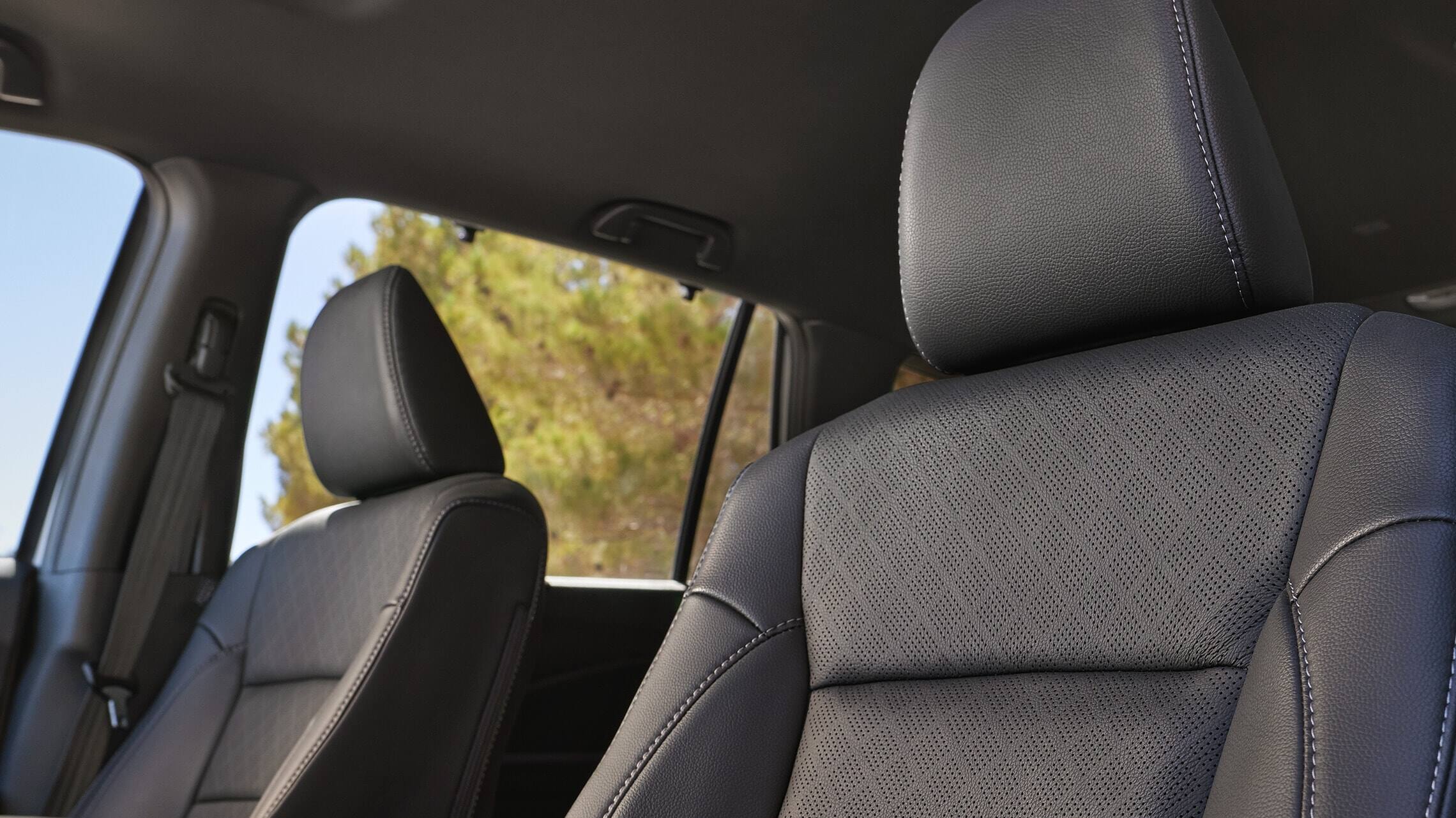 2019 Honda Passport Elite interior front seats with Black Leather trim.